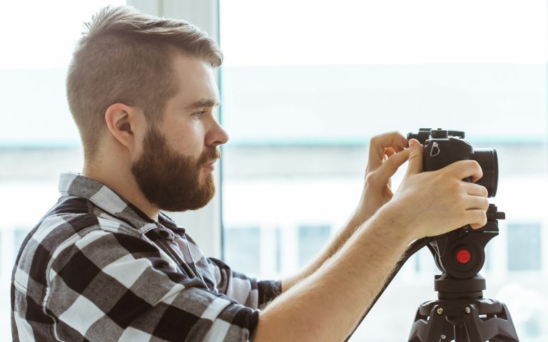 Video production concept - Operator working with a camera.
